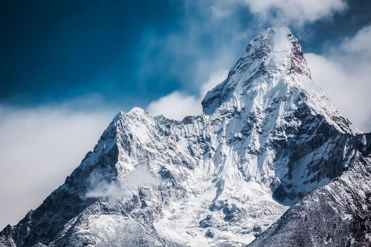 Grey mountain peaks covered in snow and surrounded by heavy clouds. France also houses Europe's highest mountain range; this includes the Mont Blanc. Learning French will help you navigate through the natural beauty of France