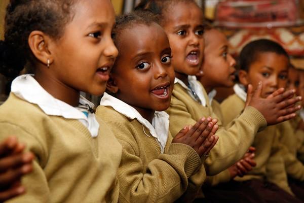 Several Ethiopian children welcome Cat Cora on her visit. They are pleased to see her, considering how much of an effort she puts into reducing world hunger via her philanthropic pursuits. Alongside Anthony Bourdain, Cat is one of the only chefs that has lived a wholesome life