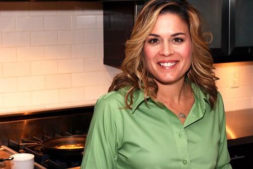 Cat Cora, recording for one of her cooking shows. Being one of the top chefs in the USA, Cat Cora has to make many appearances to promote her establishments, written material, and the causes she stands for