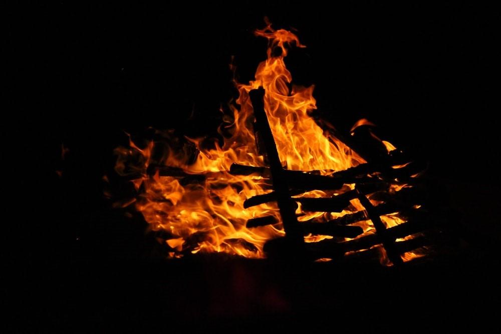 A fire burning on a pile of woods in a dark background. Combustion, which is the process that underlines ignition, also forms a core component of study in the field of chemistry. Studying chemistry will help you understand the cause and result of chemical reactions