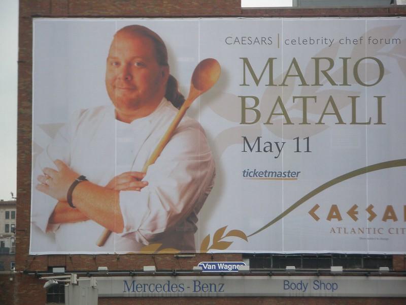 A billboard displays the renowned chef Mario Batali, advertising him as part of Caesar's celebrity chef forum. He is an American chef, author, restaurateur, and TV personality. Ceasar’s Atlantic City is a luxury destination that only hires the best for its high-roller clientele