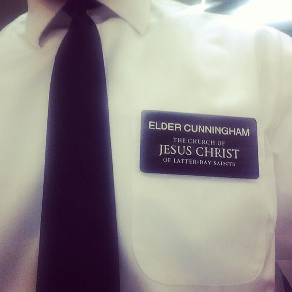 The costume for the role of Elder Cunningham in The Book of Mormon, which includes a tag that reads: "ELDER CUNNINGHAM – 'The Church of Jesus Christ Of Latter-Day Saints.'" All those representing missionaries in this musical had the same outfits