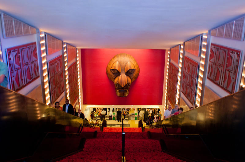 The famous Lion King headpiece is depicted on the wall at a Broadway NYC theatre entryway. It has become a symbol of this particular musical, as anyone can recognize what the mask represents. If you've seen the movie, the show should not be missed!