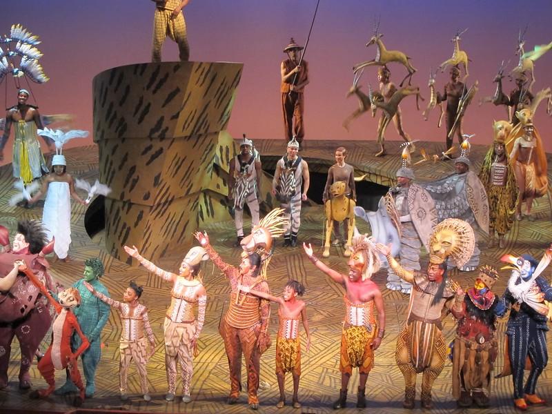 Curtain call for all the actors who took part in The Lion King's Broadway NYC production. You can see some of the essential characters, such as Timon and Zazu. Many would consider the representations as ridiculous, but upon first viewing, you will realize the art behind the production