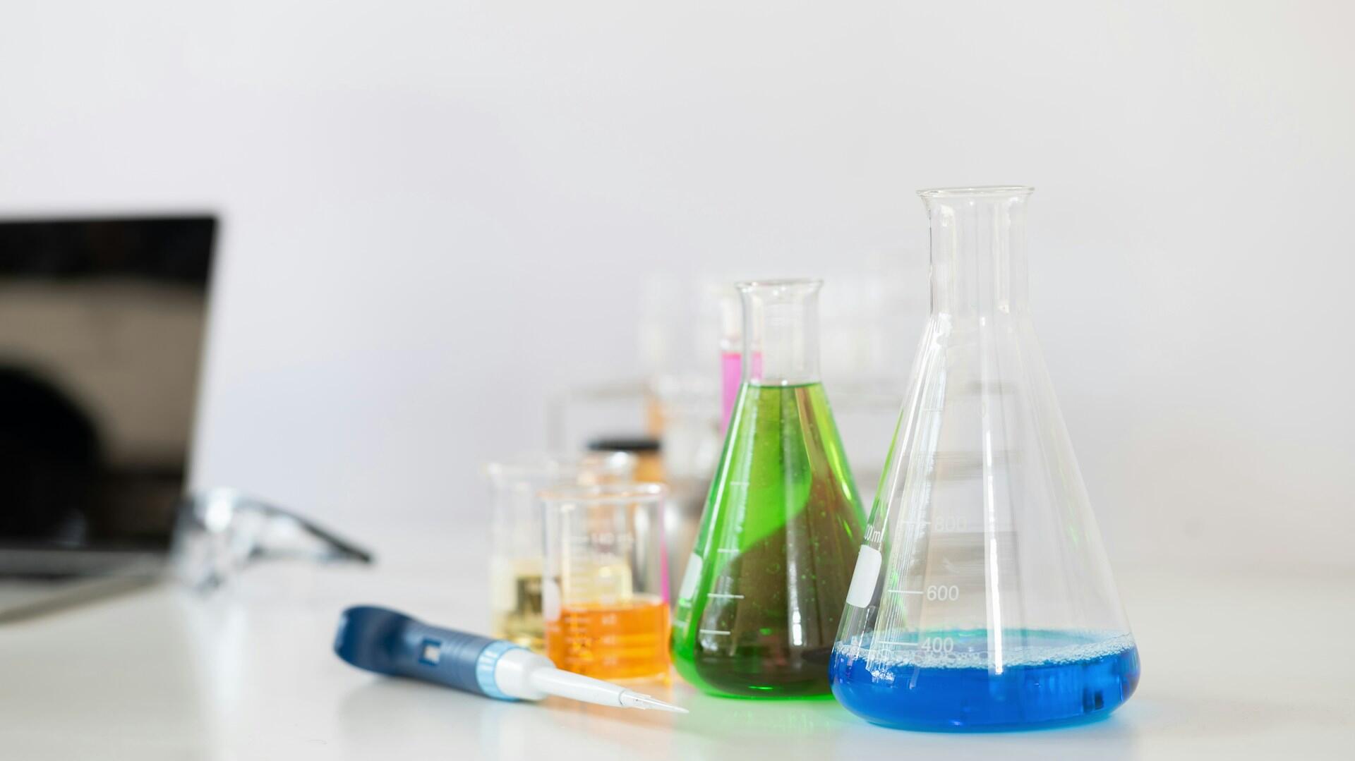 Different size and color chemistry beakers.