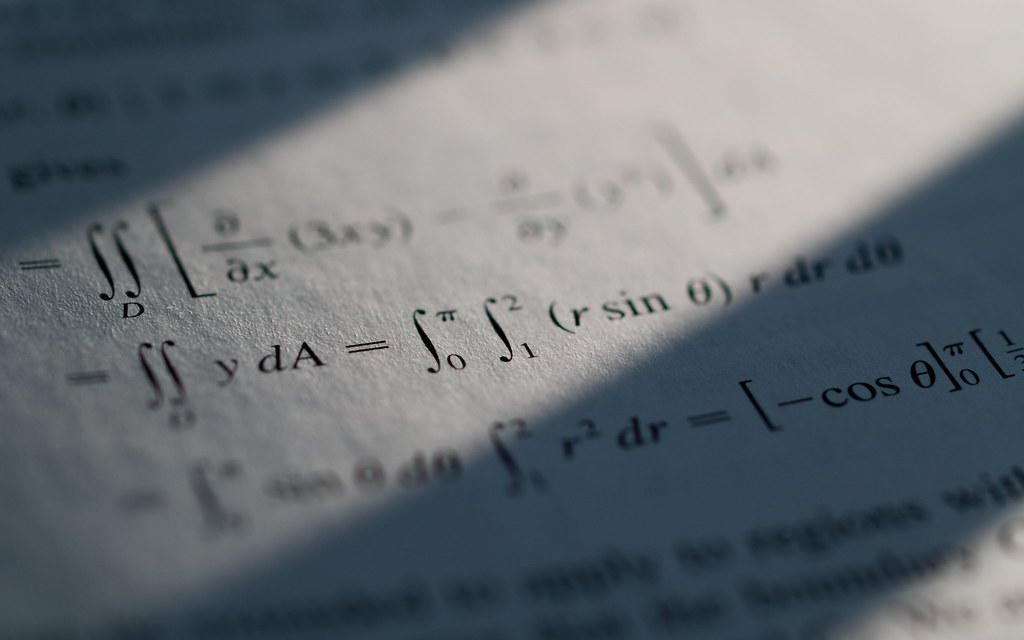 A mathematical equation printed on paper