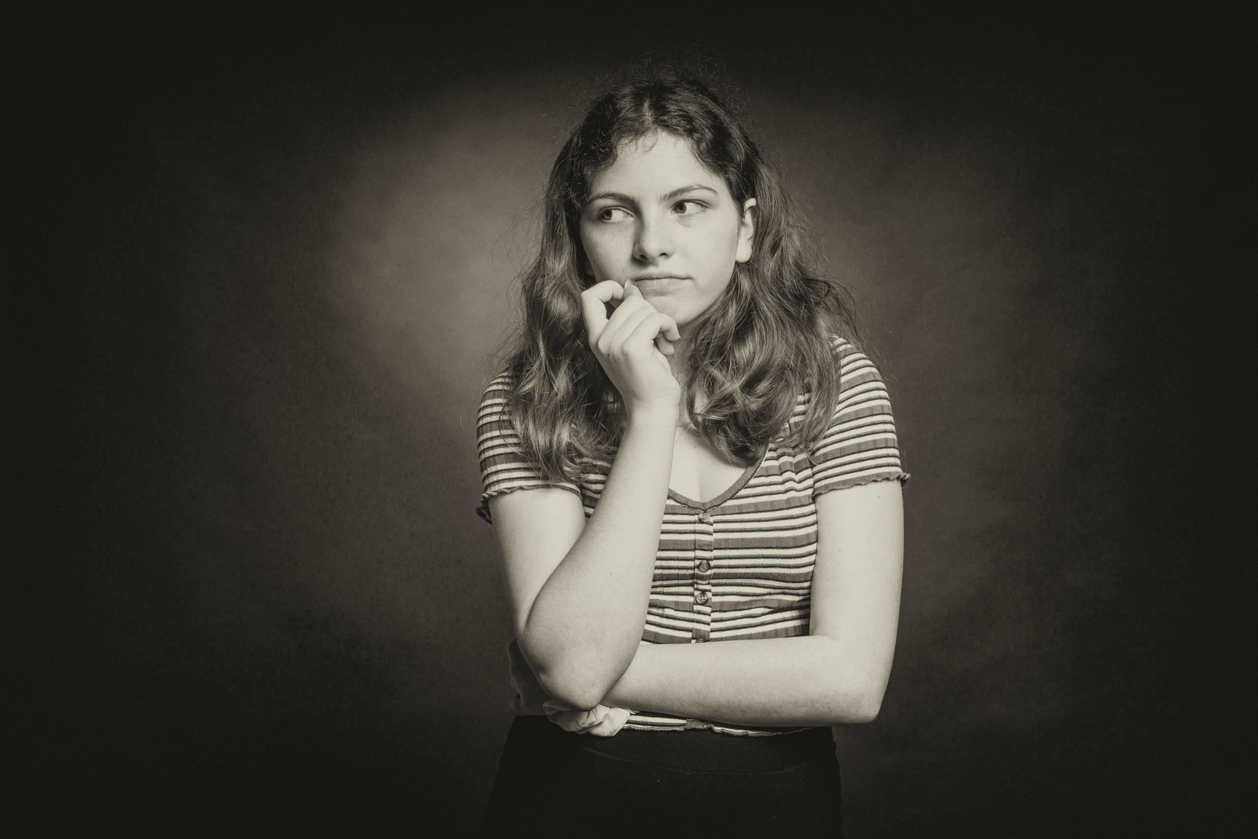 A teenager deep in thought