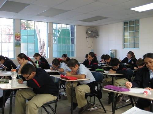 A group of middle school students sitting in a classroom during a lesson