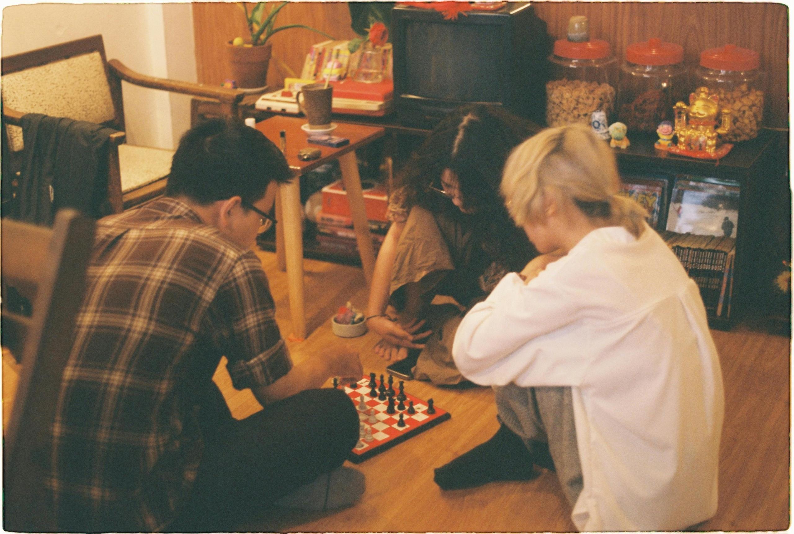 A group of friends chose to stay at home and play chess instead of boozing out for a dance in the club. 