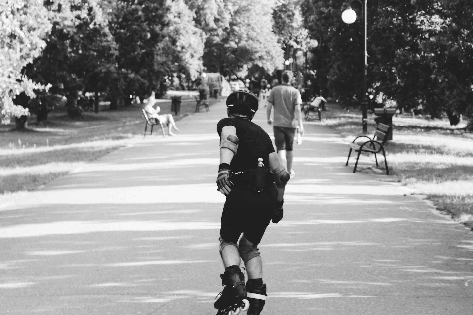 Black and white photo of someone roller skating.