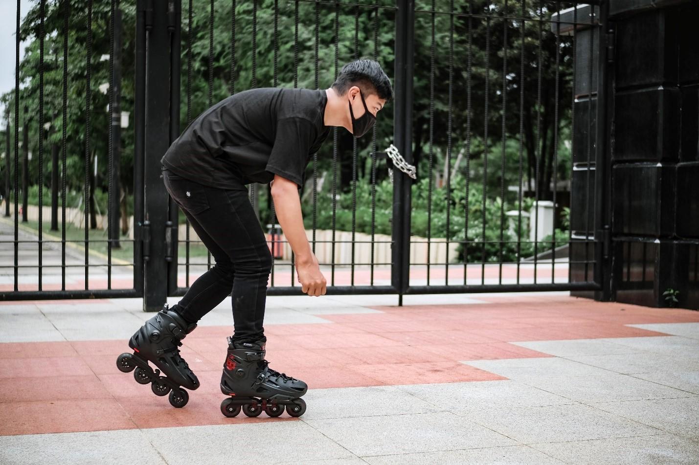 A young boy going to school on roller skates