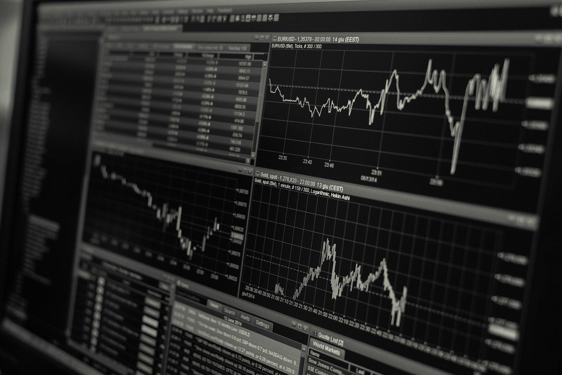 A few graphs and calculations on a screen depicting stock trends