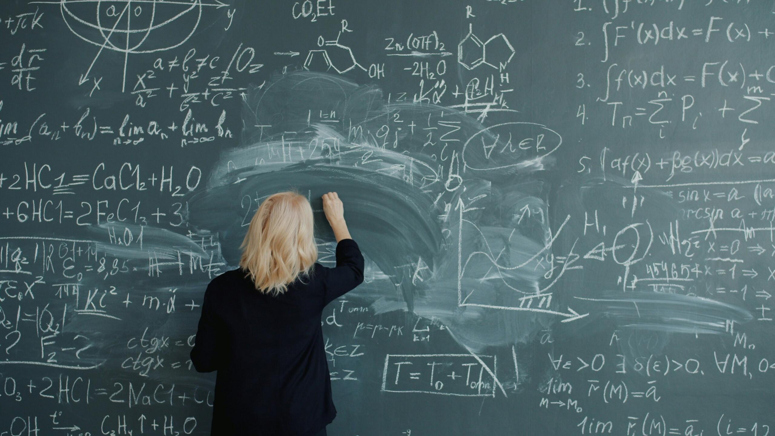 A math teacher is demonstrating how to solve a complex math equation