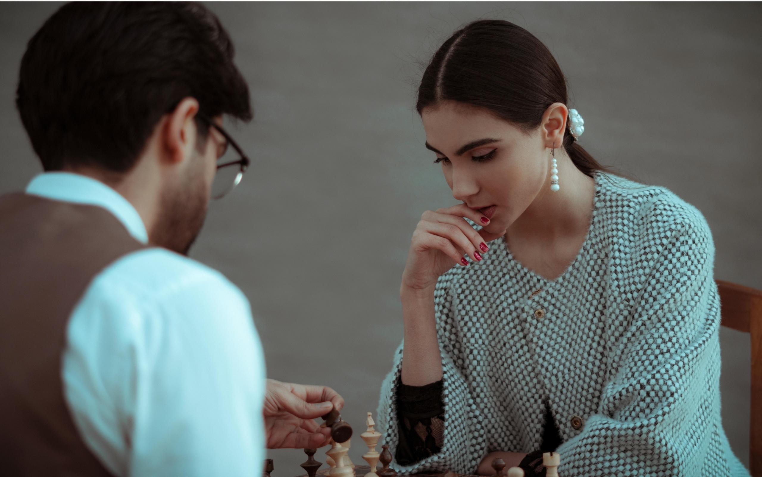 Two people playing chess
