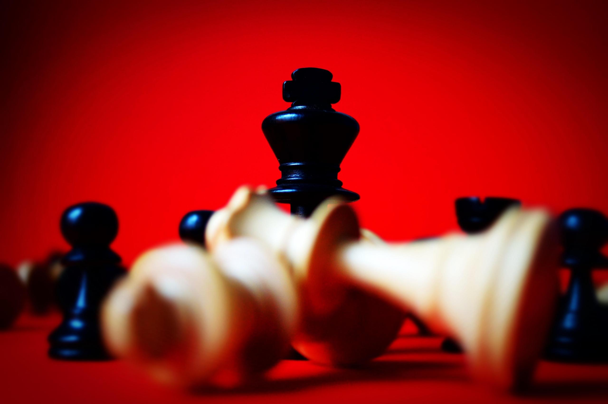 Chess pieces with a red background