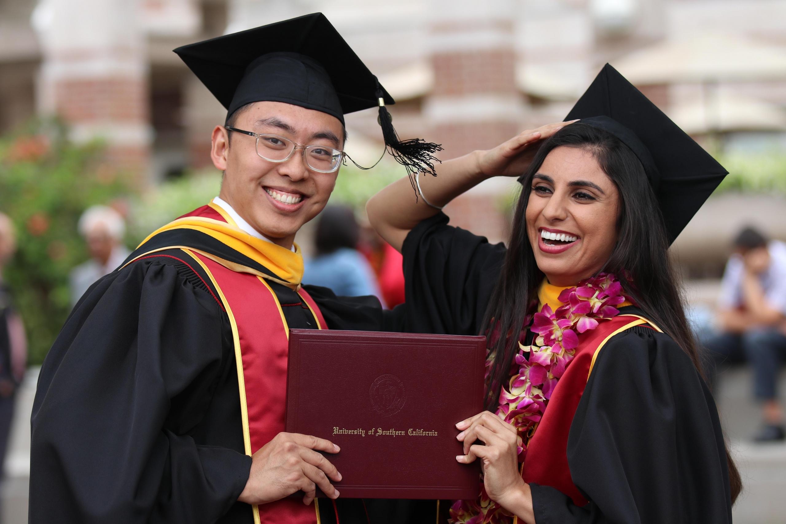 Two students graduating at USC