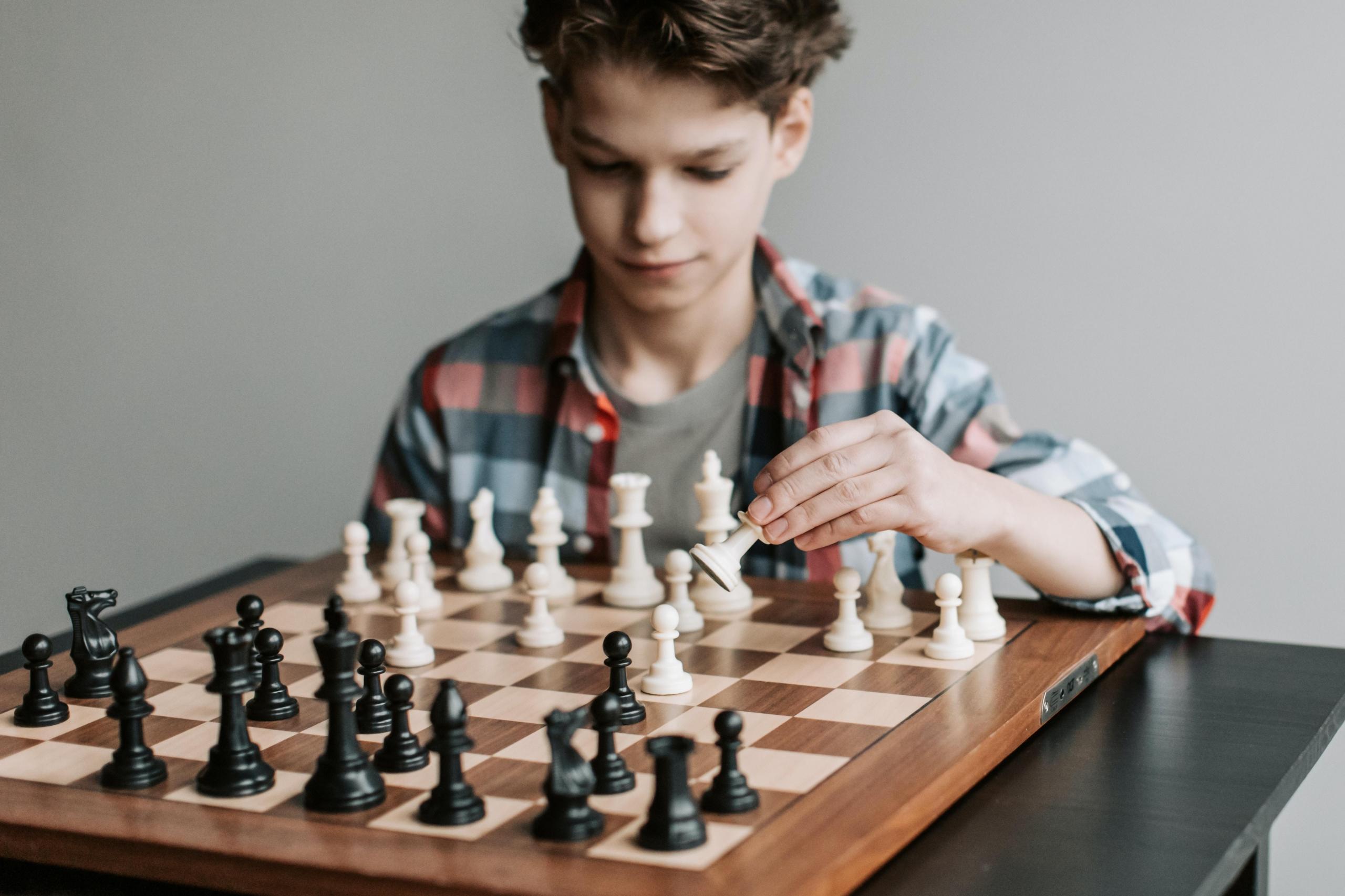 Young man playing chess 