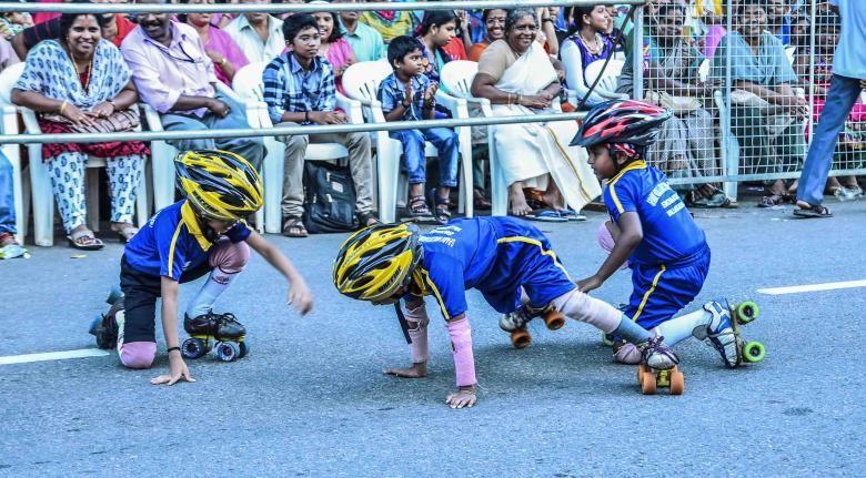 Little kids learning how to keep their balance on roller skates