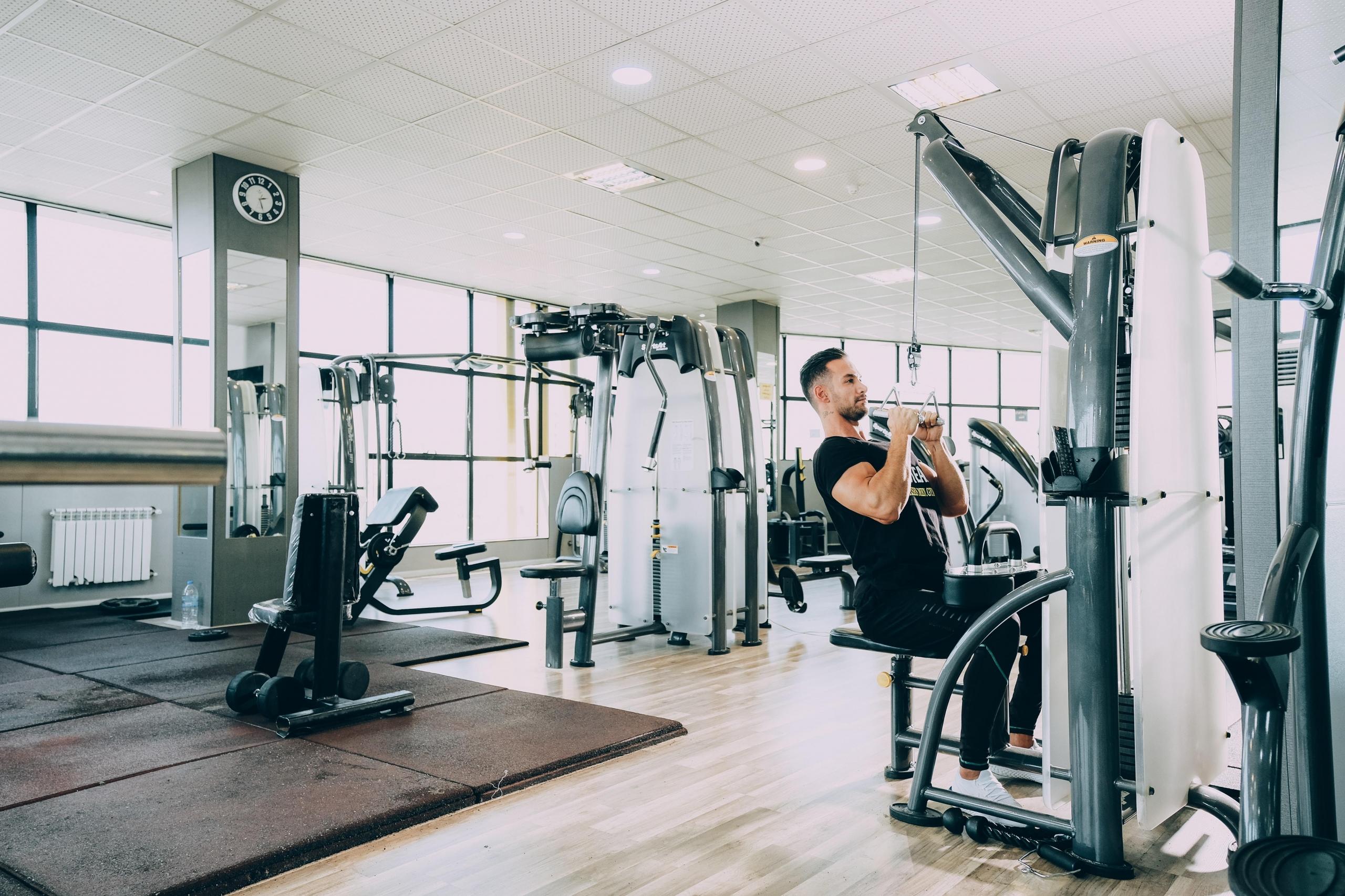 Man using gym equipment in gym