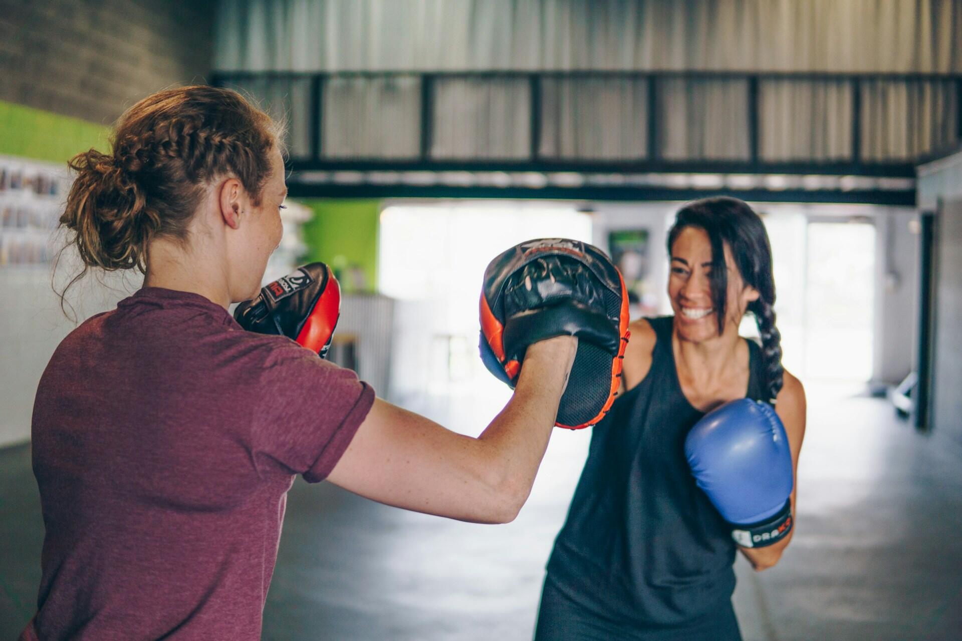 Two girls boxing
