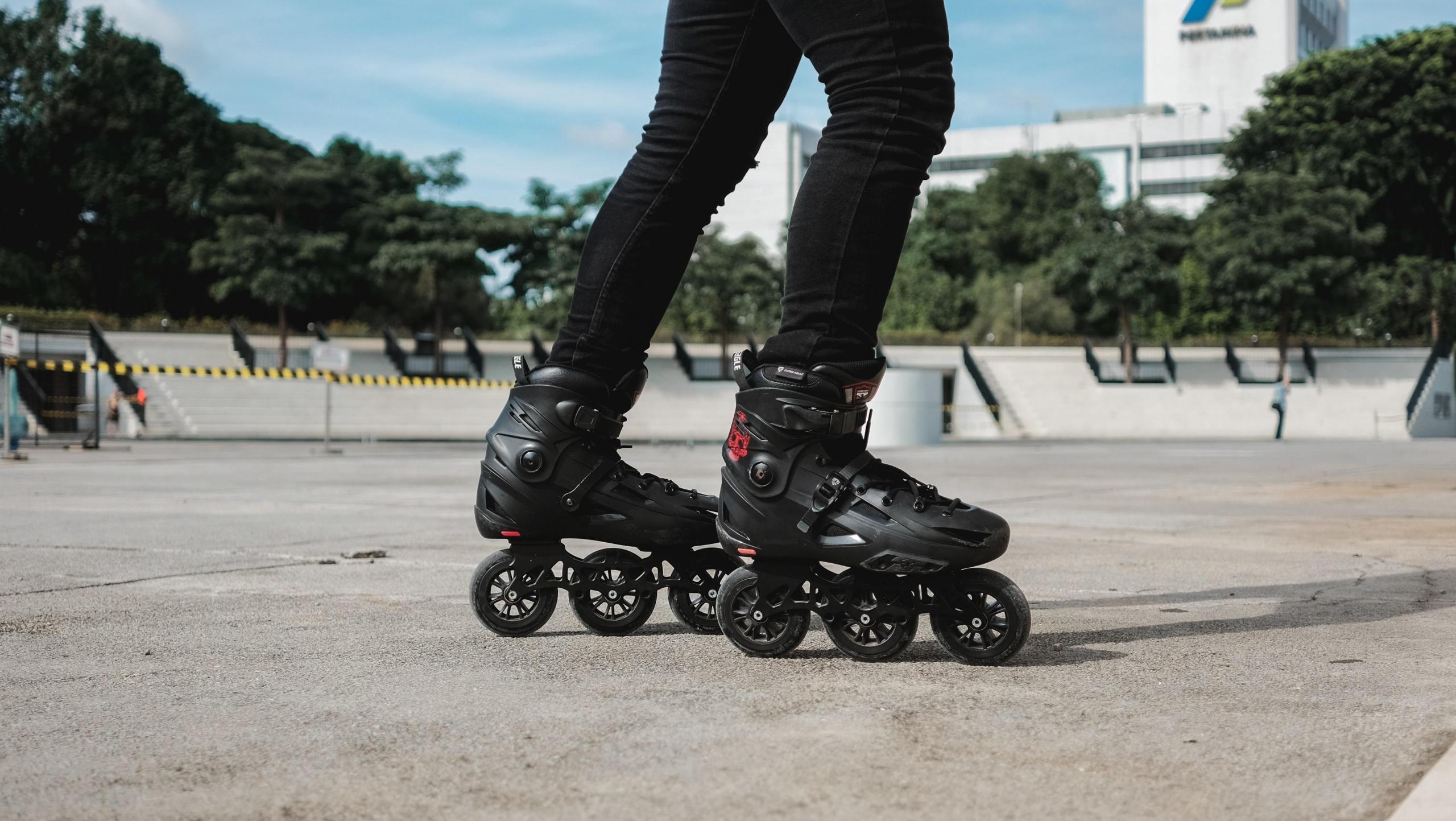 Black roller skates in a park