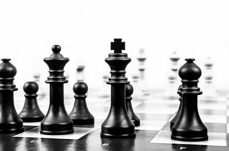 The black Queen checkmating the white King