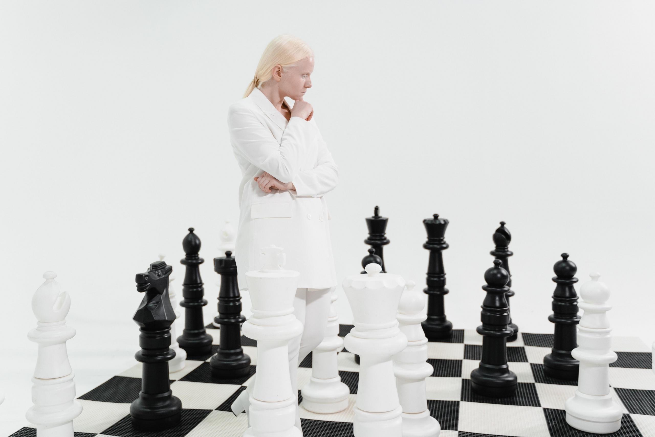 Woman standing on a chess board