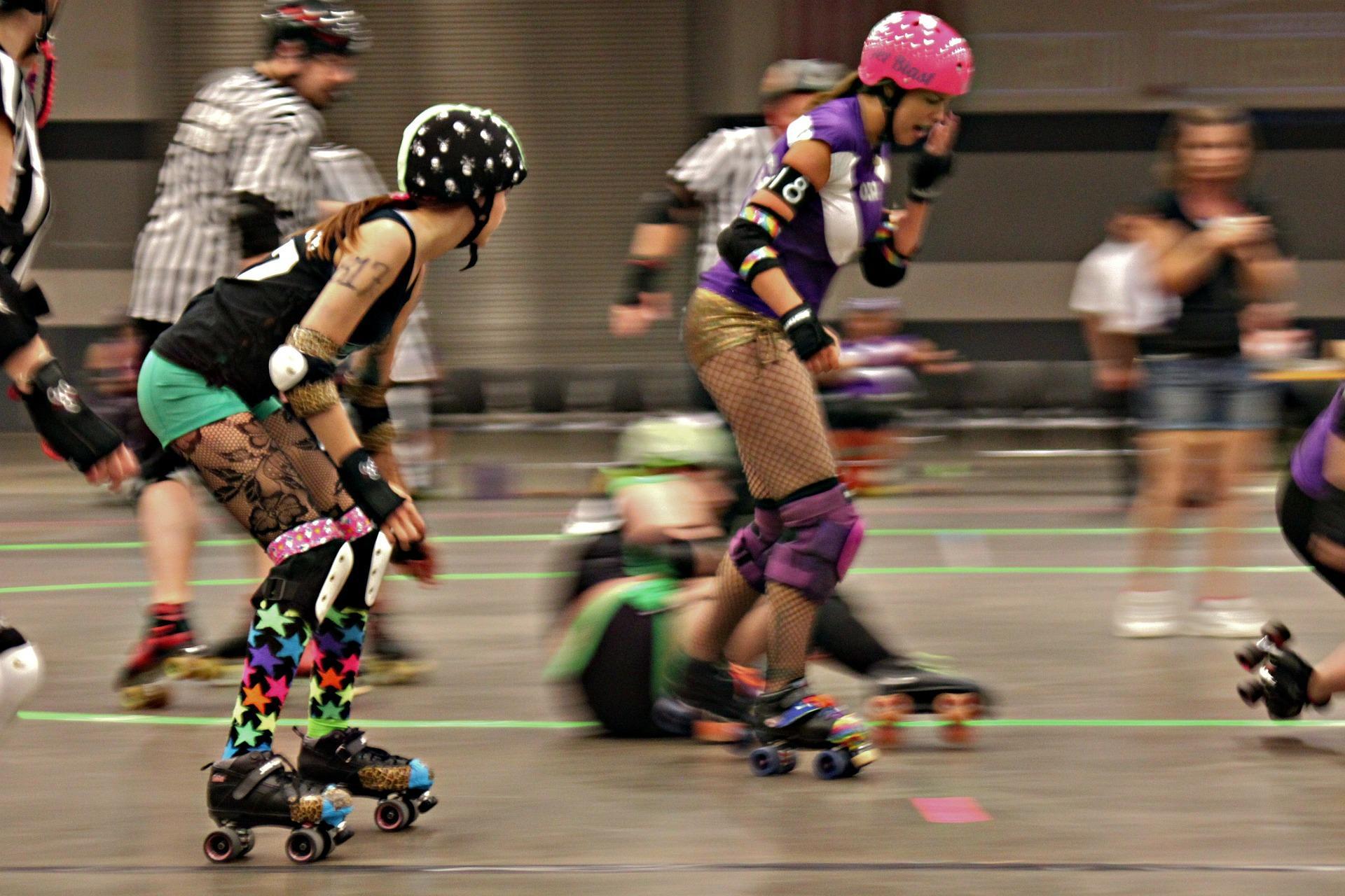 A couple of people at a roller skating rink
