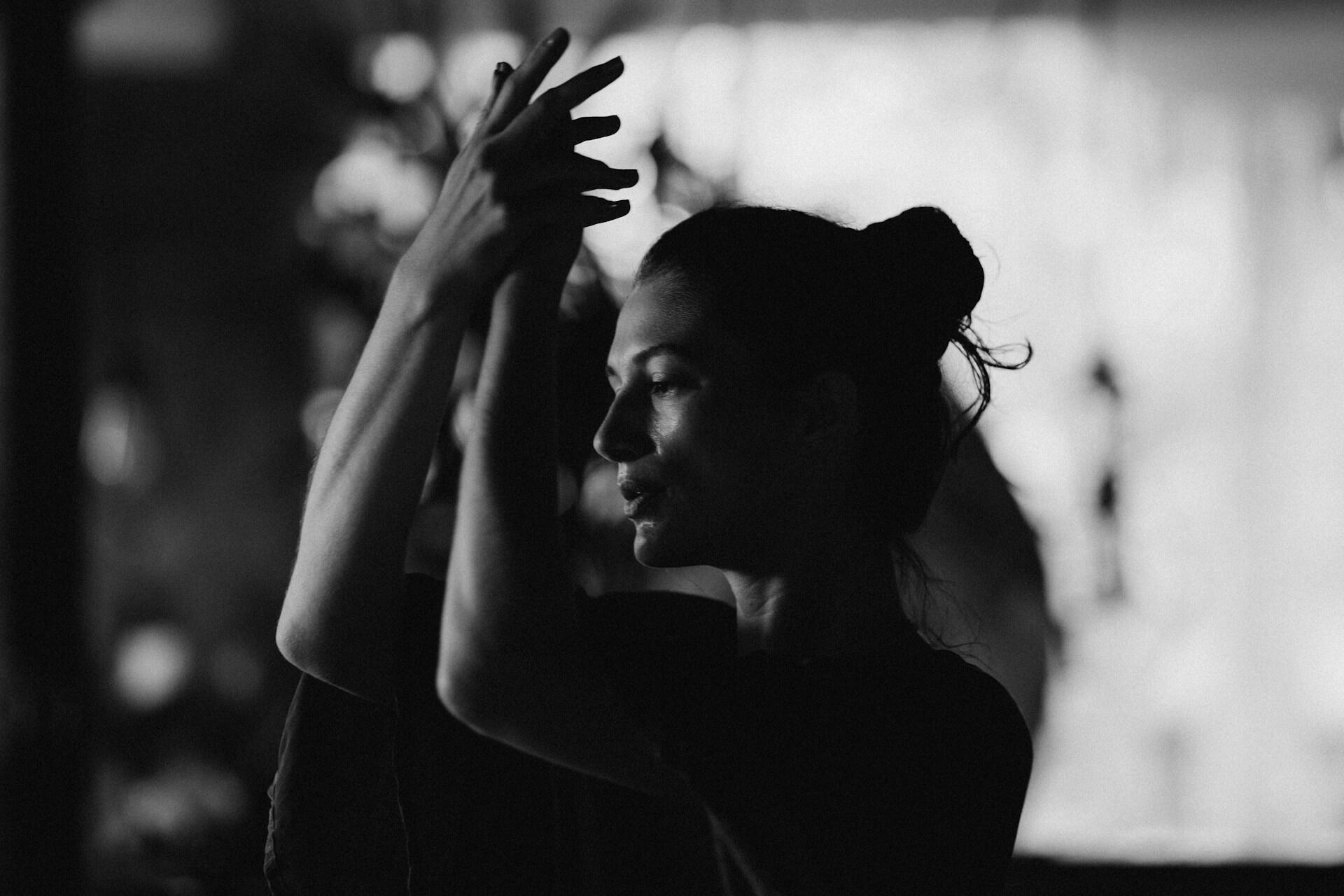 Choreographer practices dance moves.