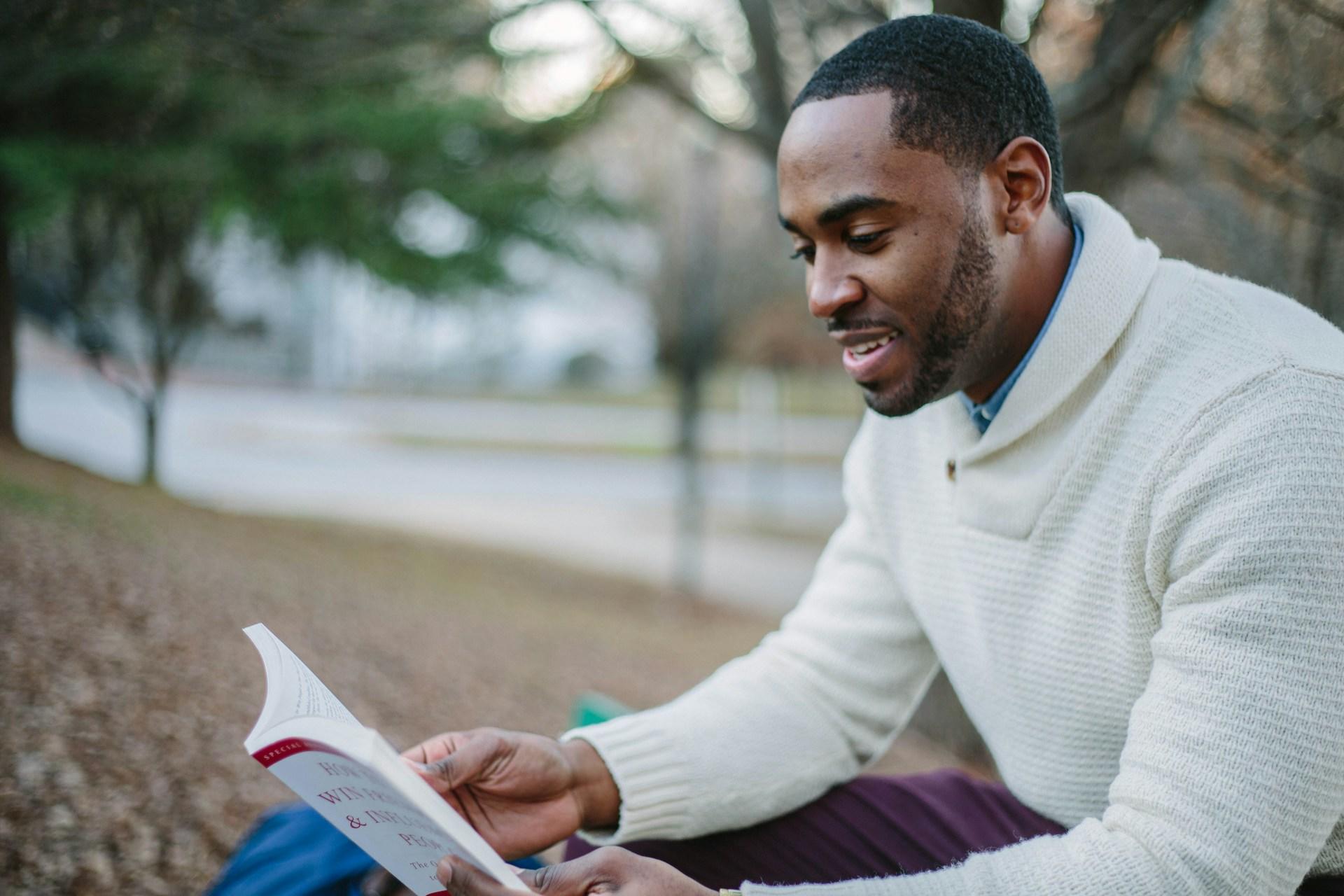 A student reading a book and studying.
