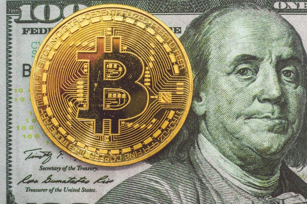 Bitcoin on a hundred-dollar bill