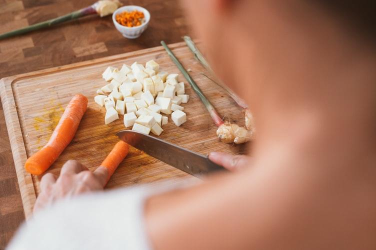 Woman cutting vegetables