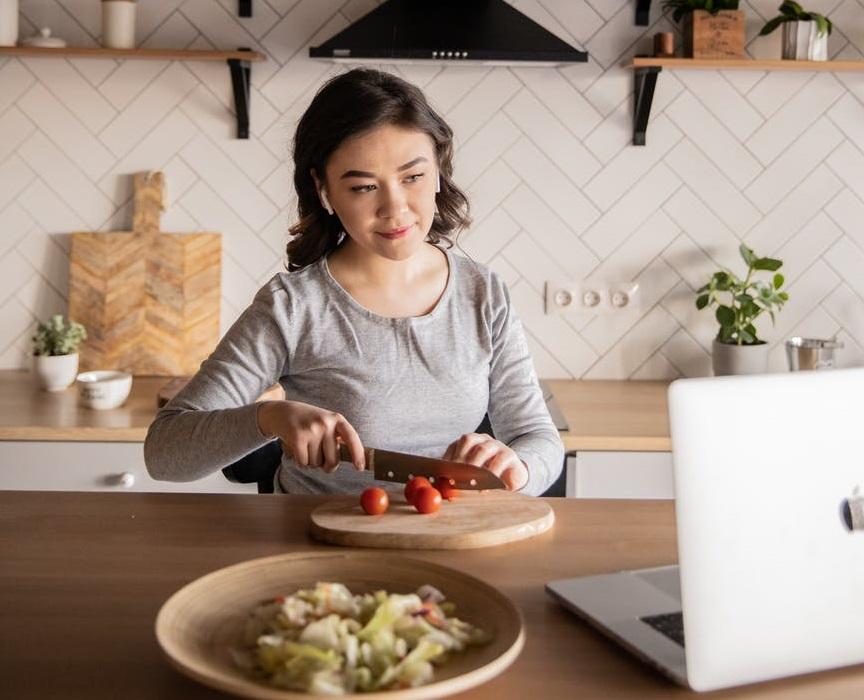 Watching a tutorial and cutting vegetables