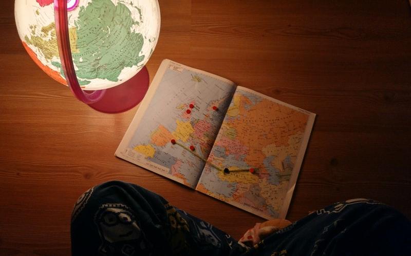 A glowing globe and a map