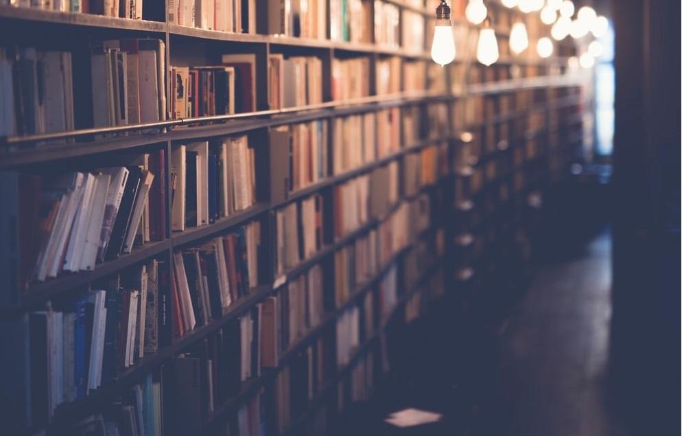 A shelf filled with books in the library
