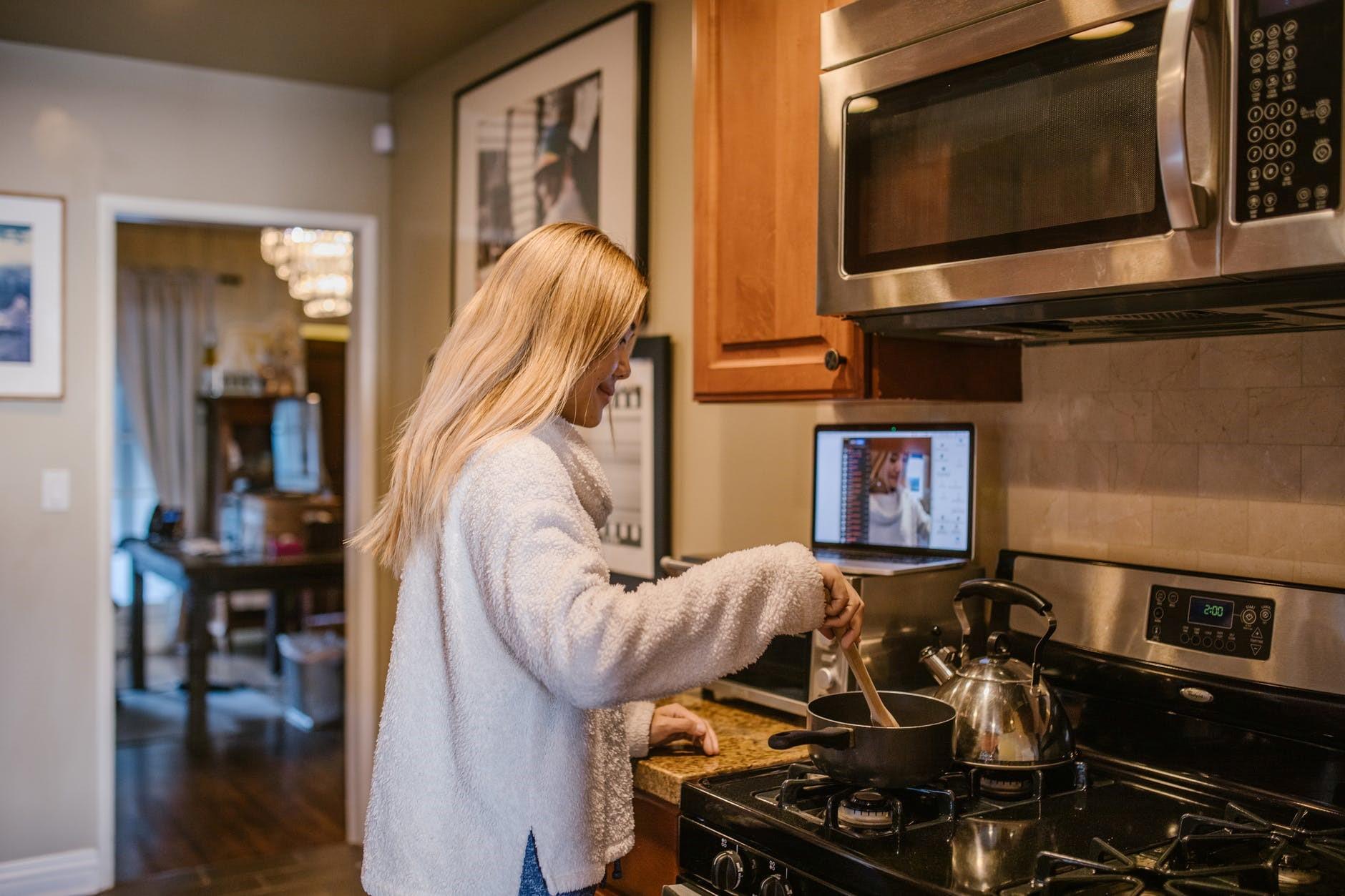 An online cooking teacher recording herself