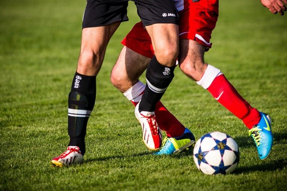 College soccer players vying for control of possession