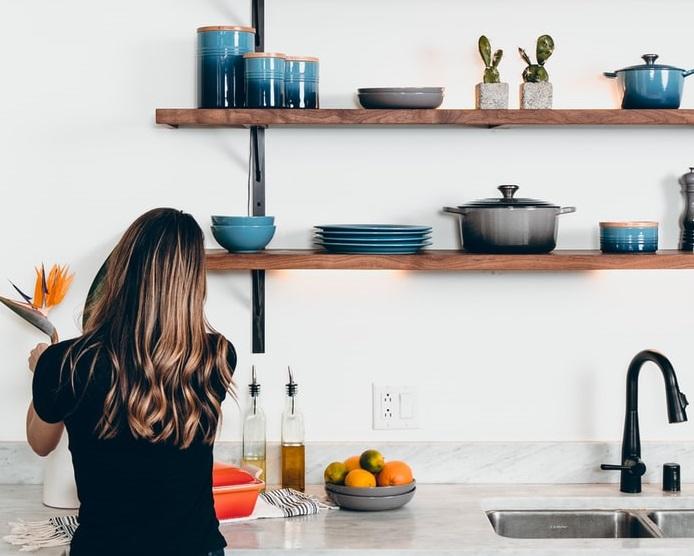 A woman cooking in a kitchen
