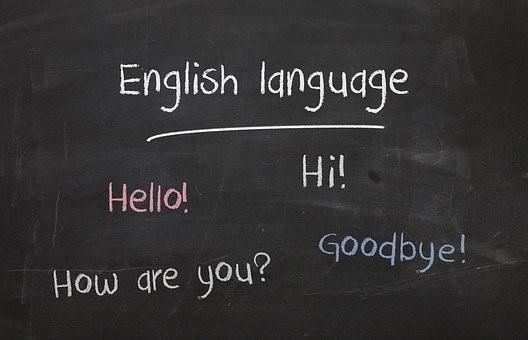 English greeting phrases written on a blackboard