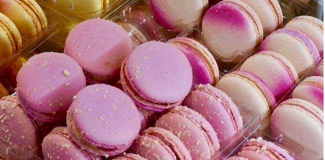 Colorful macaroons arranged in containers