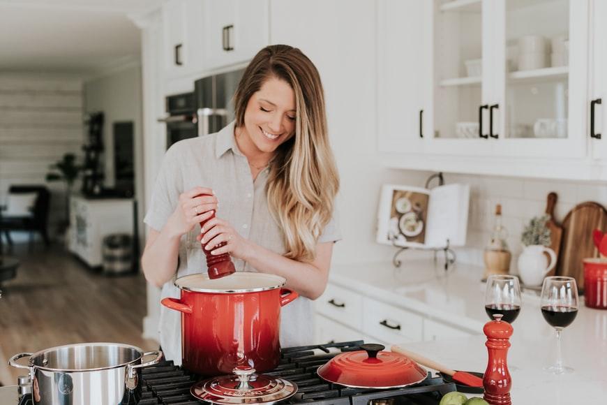 A beginner chef is cooking using eco-friendly cooking utensils