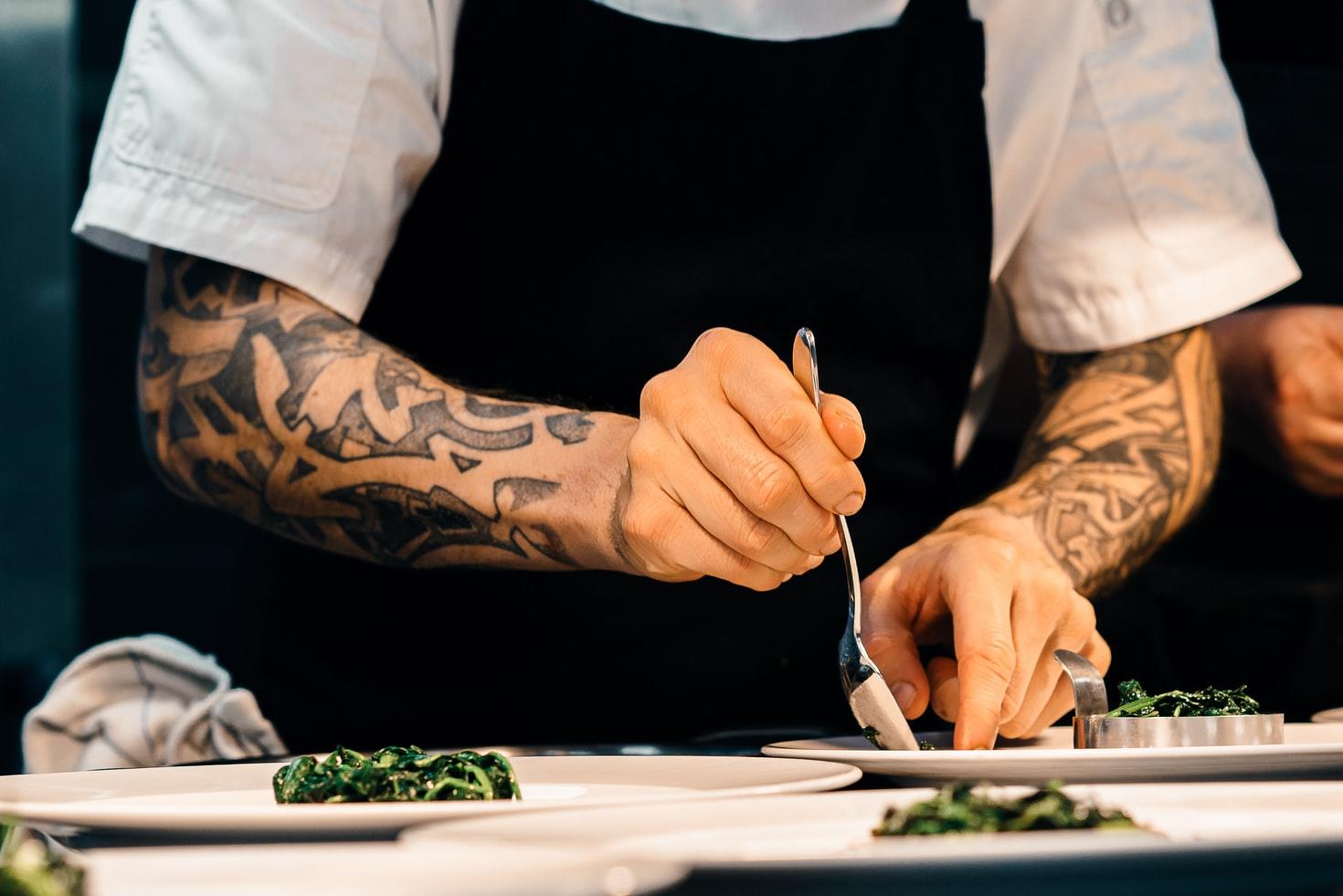 Chef garnishing dishes