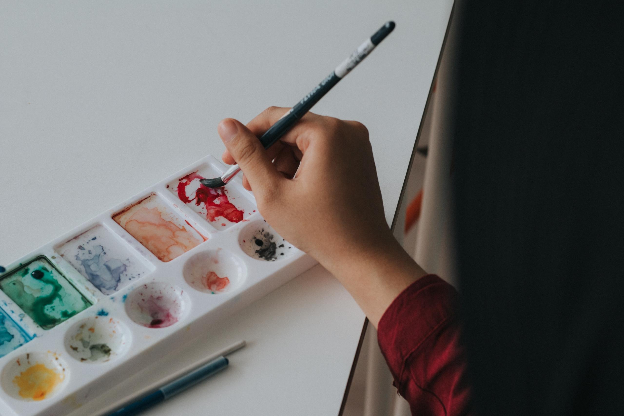 A person holding a paintbrush