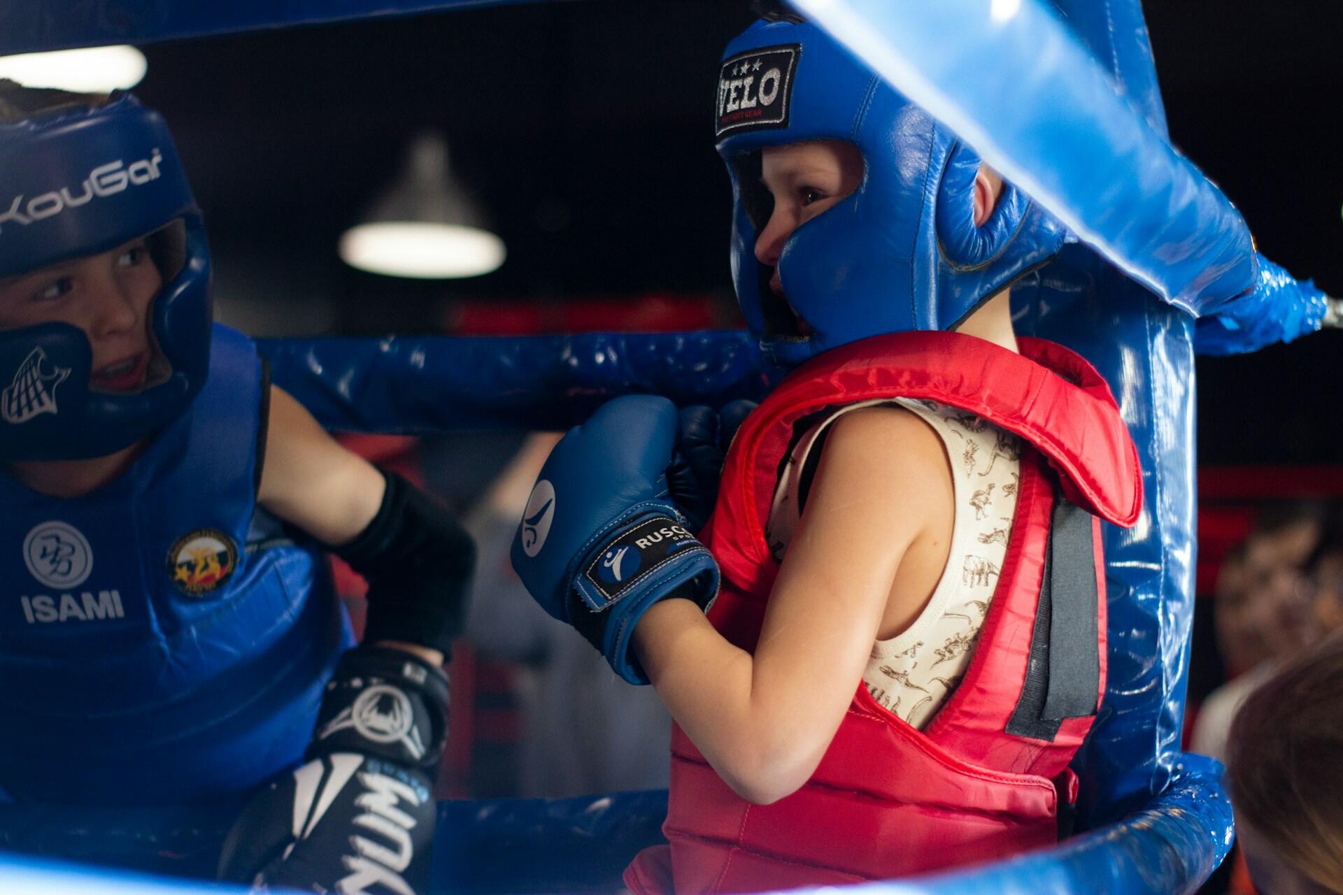 Little boy in a boxing ring.