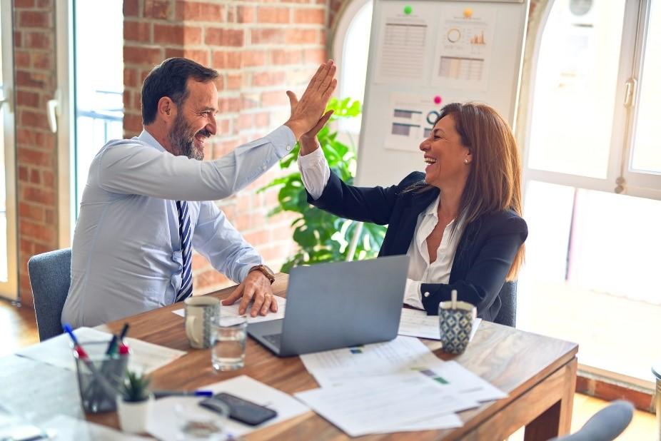 Ecstatic business professionals in a meeting room