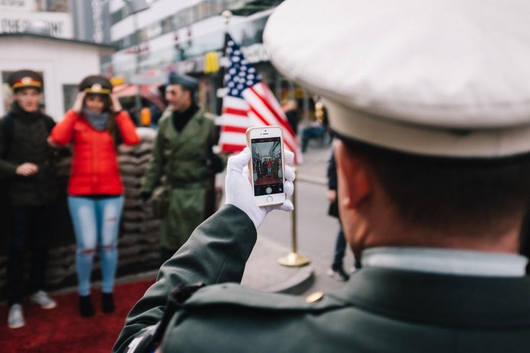 An U.S. army officer is clicking a picture of German soldiers