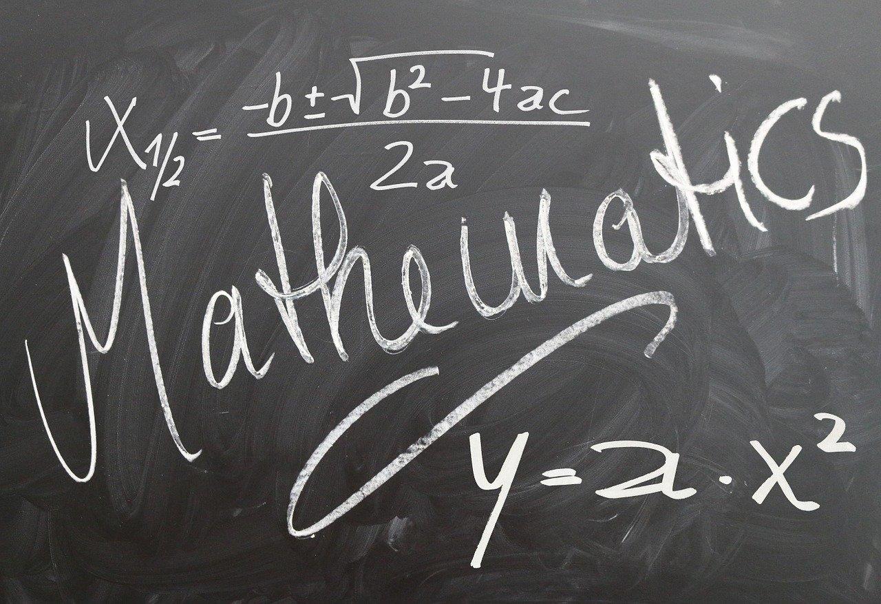 An equation is written above the word mathematics and one below it