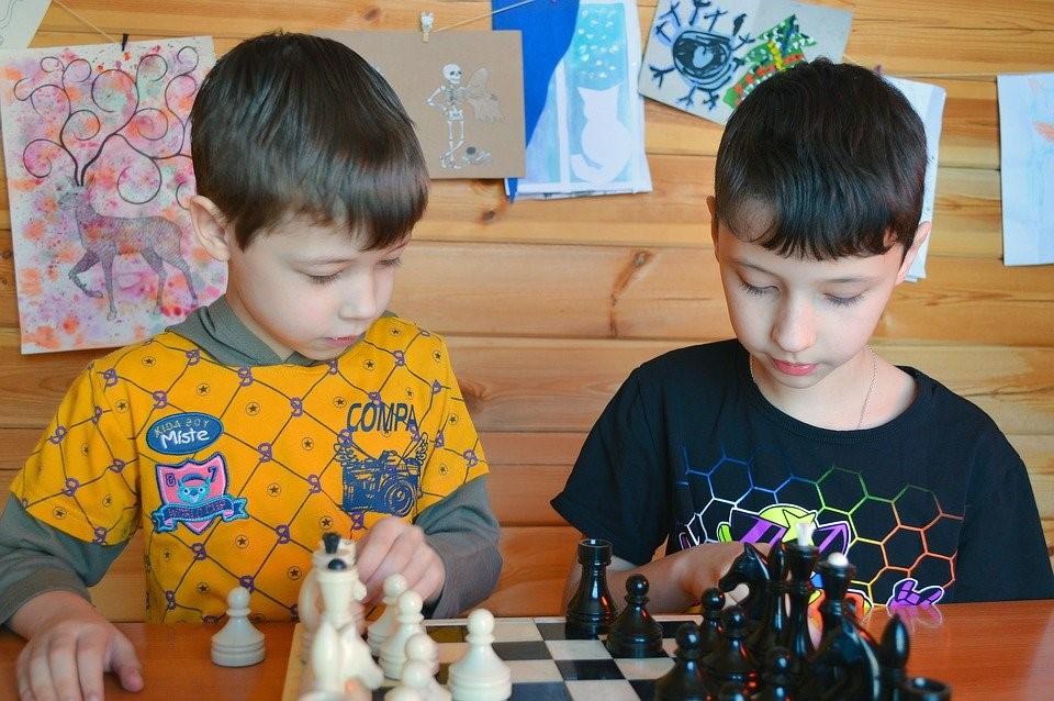 Kids learning to play chess