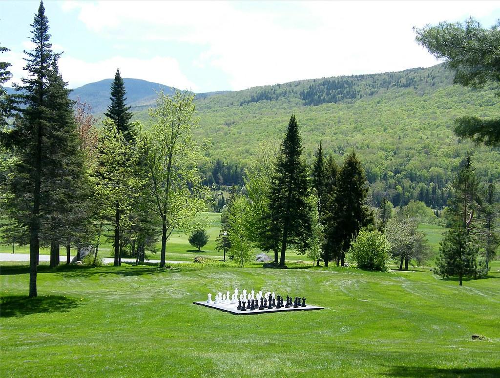 A life-size chess set in the middle of a field