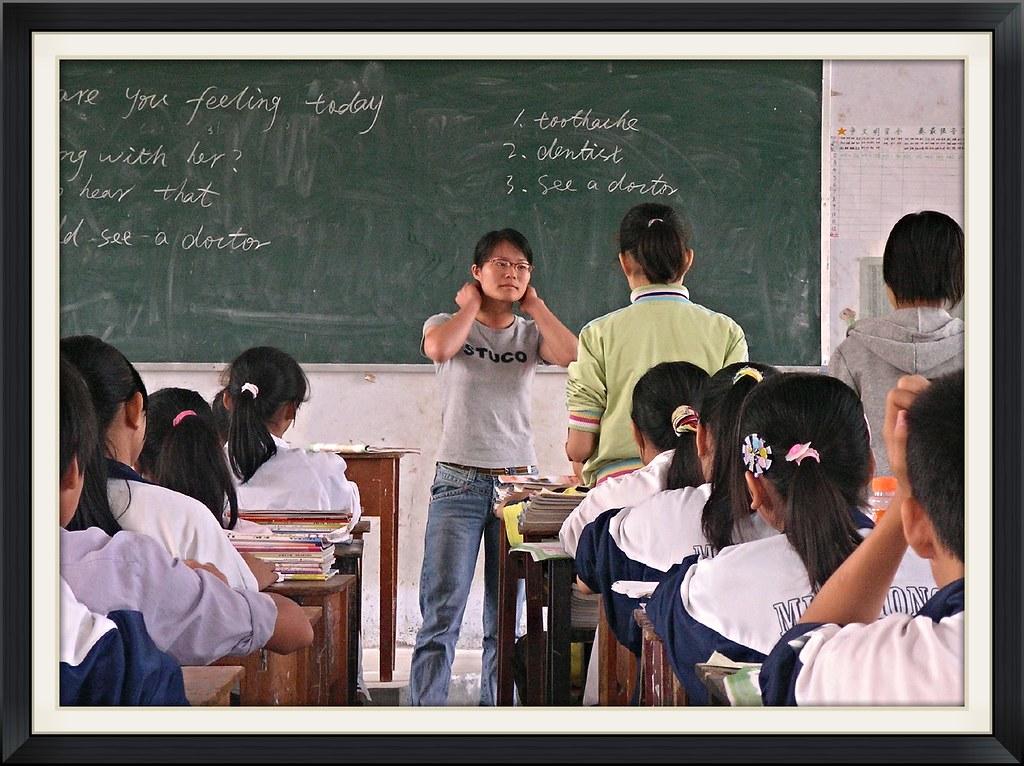 A teacher teaching ESL lessons to school students